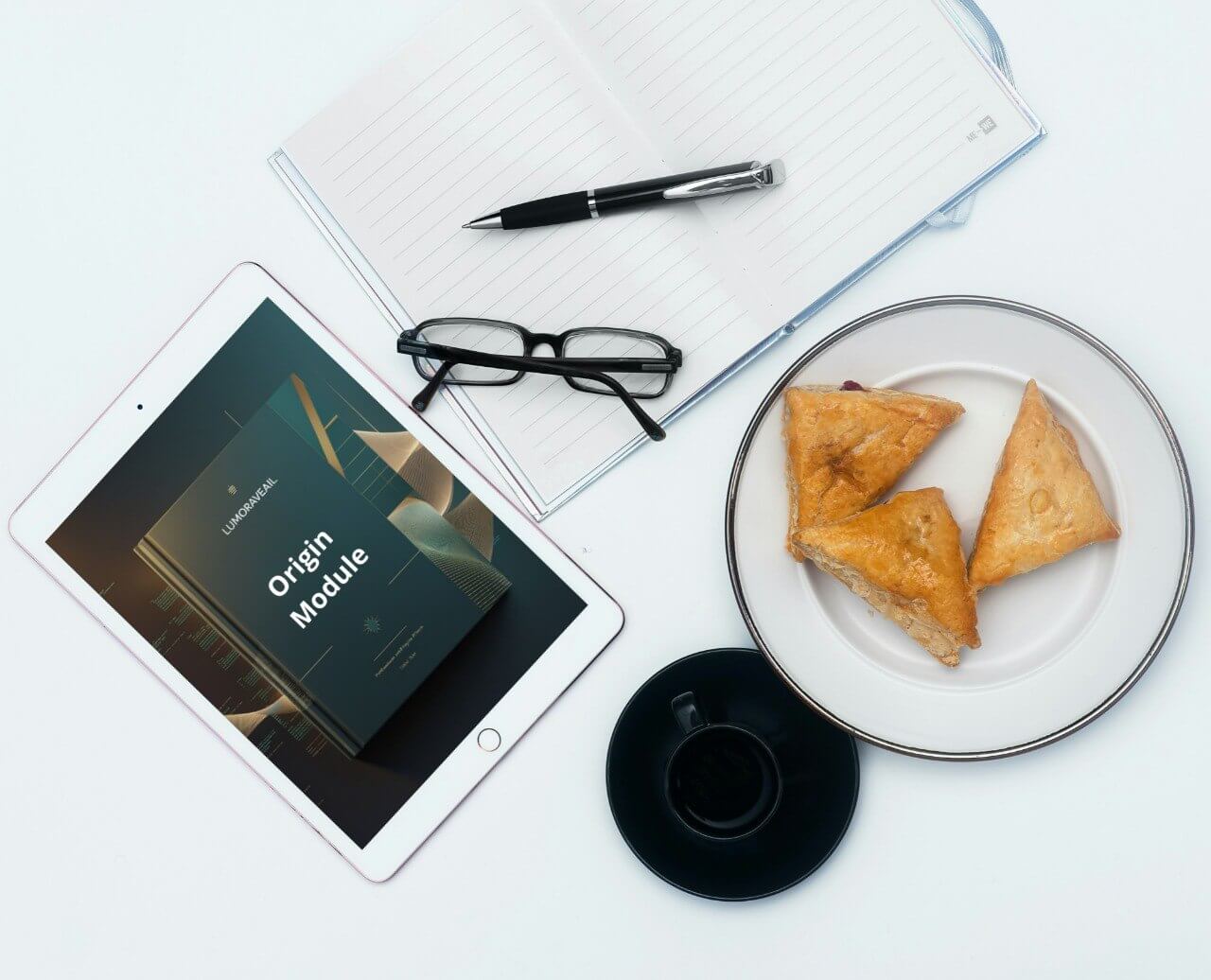 Tablet display Swift PDF course 'Origin Module' , glasses, plate with pastries, and coffee cup on a white surface